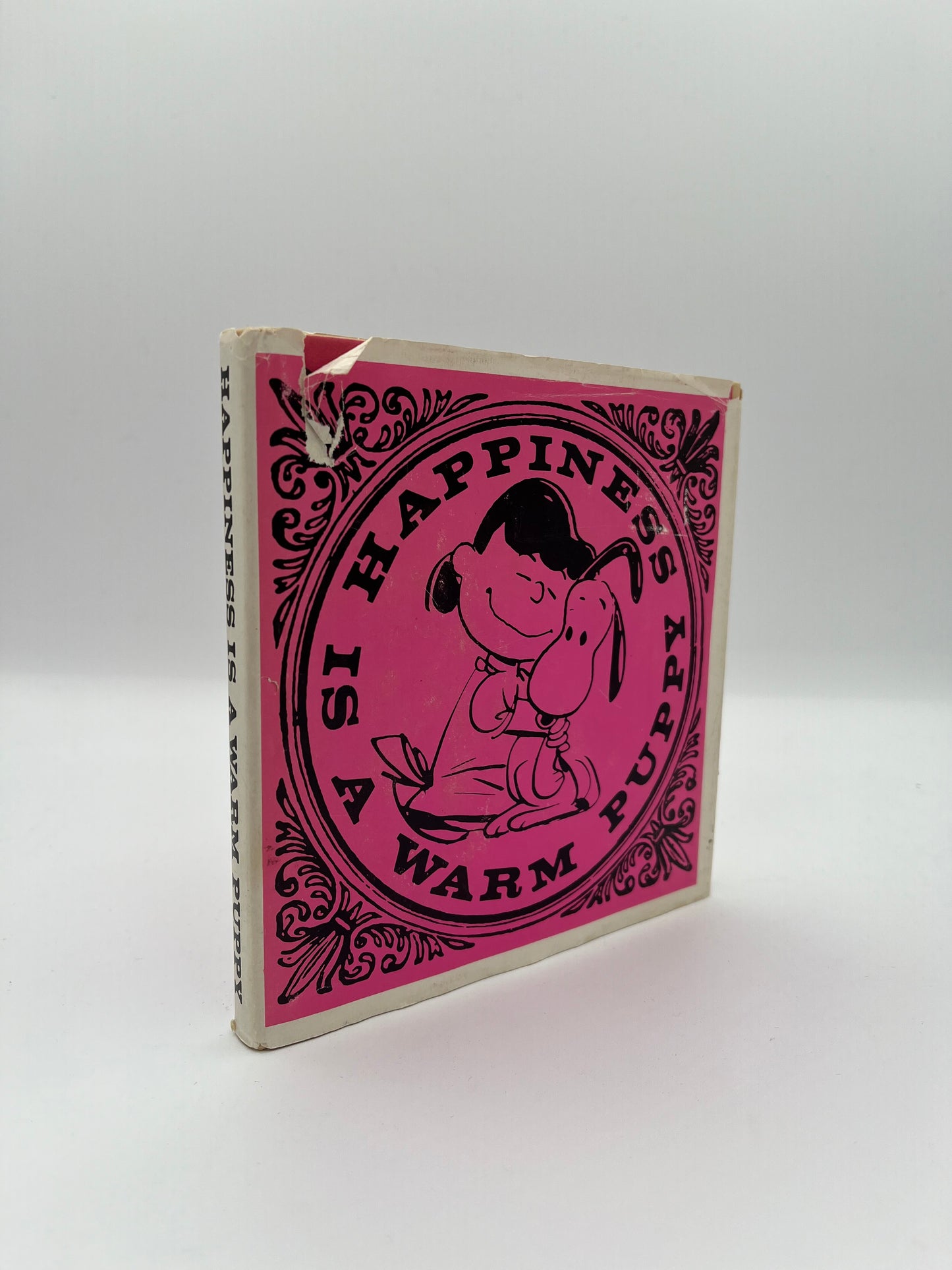 Happiness is a Warm Puppy, first edition of first Peanuts collecton